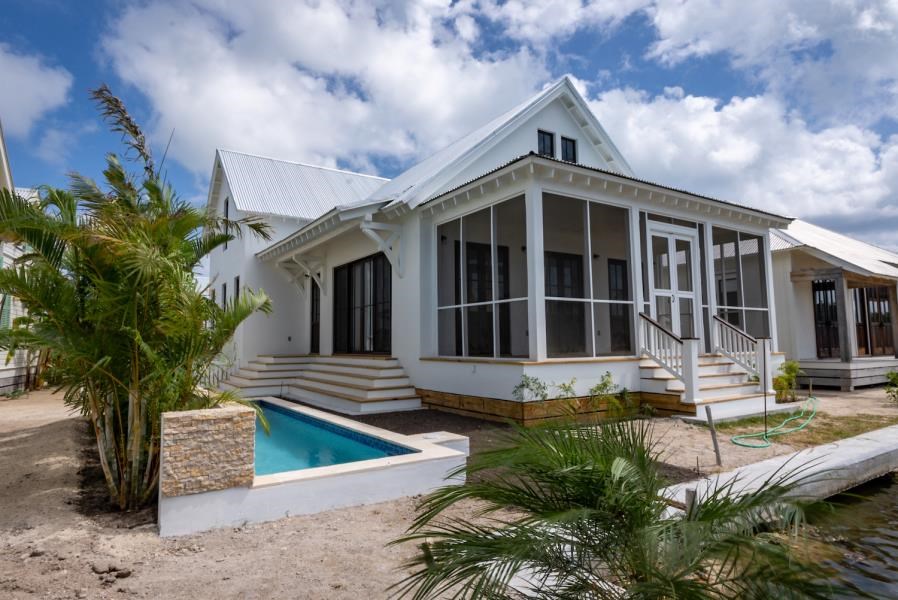 RE/MAX real estate, Belize, Ambergris Caye, 5 Bedroom Canal-Front Home with Pool & Boat Slip